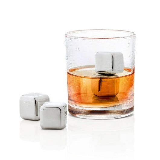 blomus LOUNGE stainless steel ice cubes cooling a glass of caramel colored liqour
